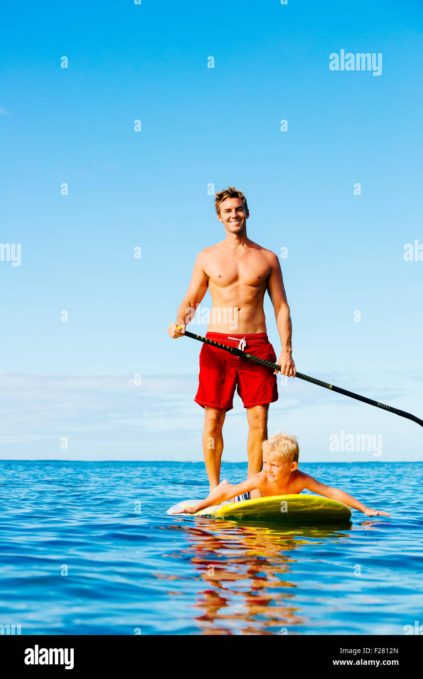 Father and Son Stand Up Paddling. Having Fun Outdoors. Summer Lifestyle. Stock Photo