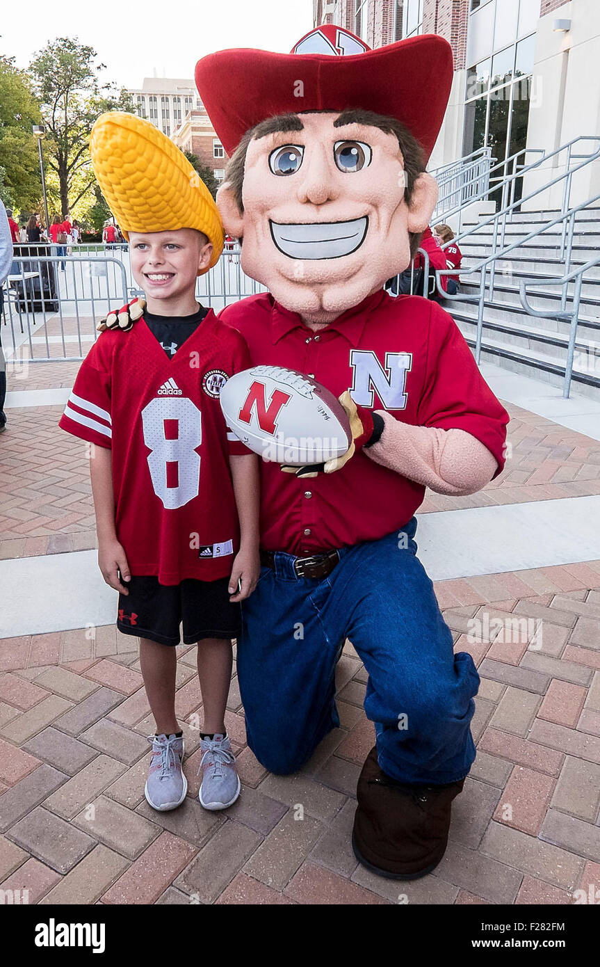 Lincoln, NE. USA. 12th Sep, 2015. Nebraska Cornhuskers mascot Herbie poses with a young fan before an NCAA Division 1 football game between the South Alabama Jaguars and Nebraska Cornhuskers at Memorial Stadium in Lincoln, NE.Attendance: 89,822.Nebraska won 48-9.Michael Spomer/Cal Sport Media. © csm/Alamy Live News Stock Photo