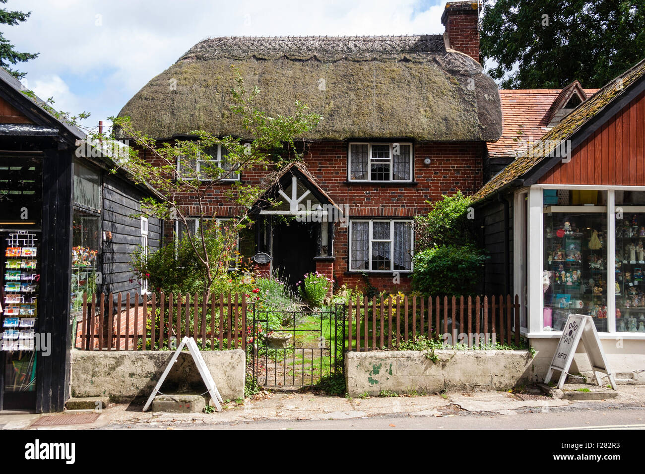 England, New Forest, Burley. Charming quaint thatched roof two story