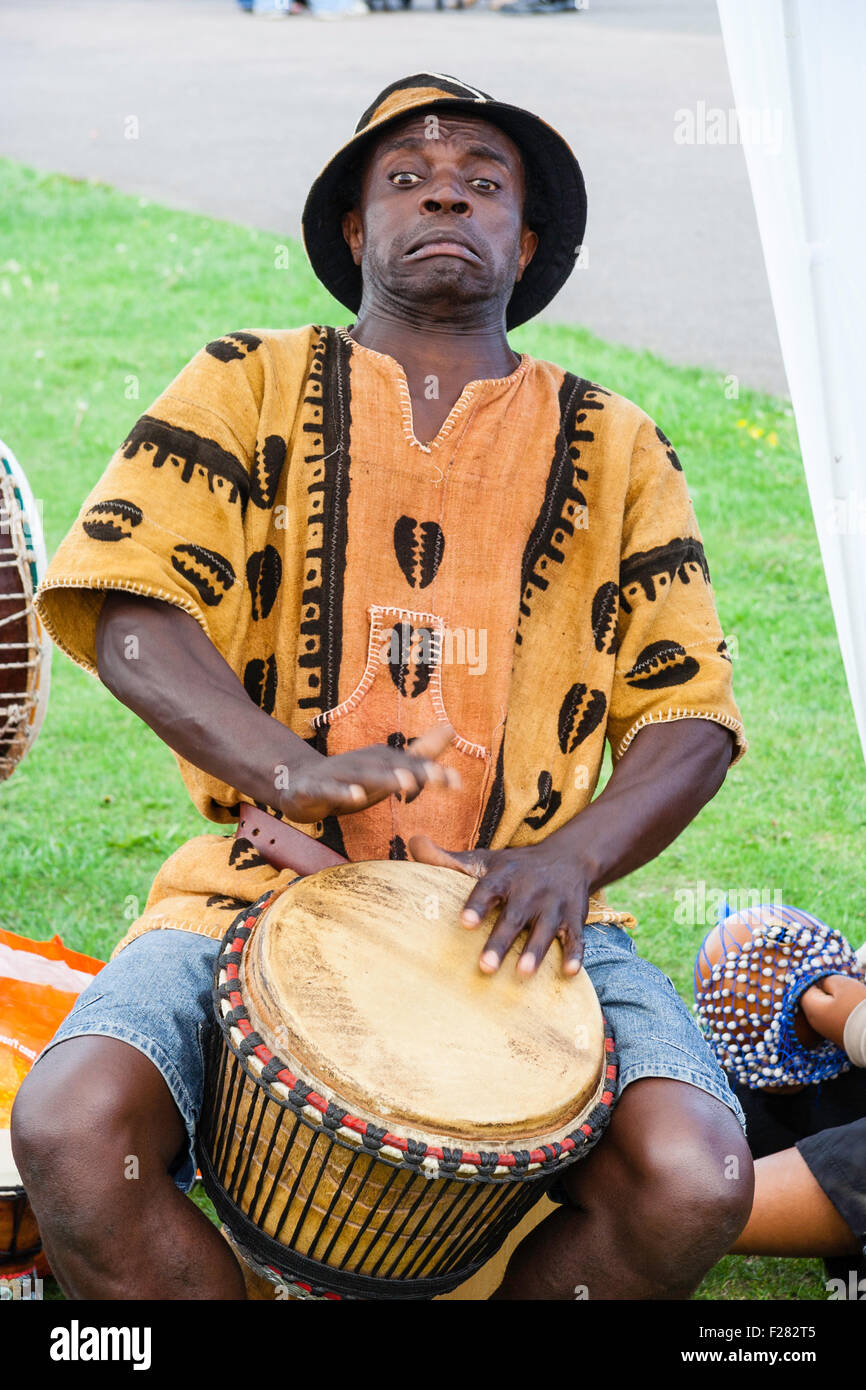 African man playing drums hi-res stock photography and images - Alamy