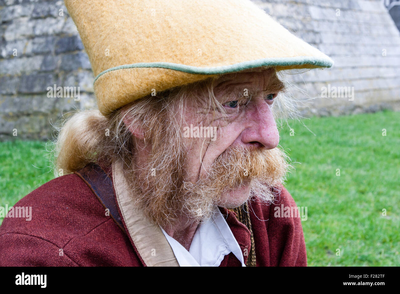 Close up of Phil Howard. Senior adult male. Very characterful face with long bushy sideburns and drooping moustache, dressed as medieval minstrel. Stock Photo