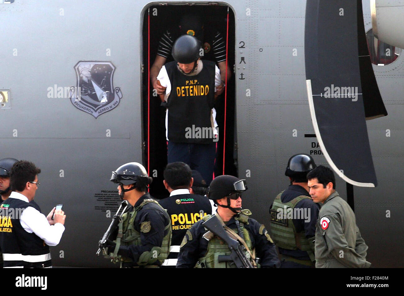 Lima, Peru. 13th Sep, 2015. Alleged drug trafficker Gerald Oropeza (Top), is escorted by policemen upon his arrival to Lima, Peru, on Sept. 13, 2015. Gerald Oropeza, an alleged drug trafficker on the Peru?s most wanted list, was arrested in a joint operation between an Ecuadorean and Peruvian anti-narcotics unit in the Ecuadorean state of Santa Elena. Credit:  Norman Cordova/ANDINA/Xinhua/Alamy Live News Stock Photo