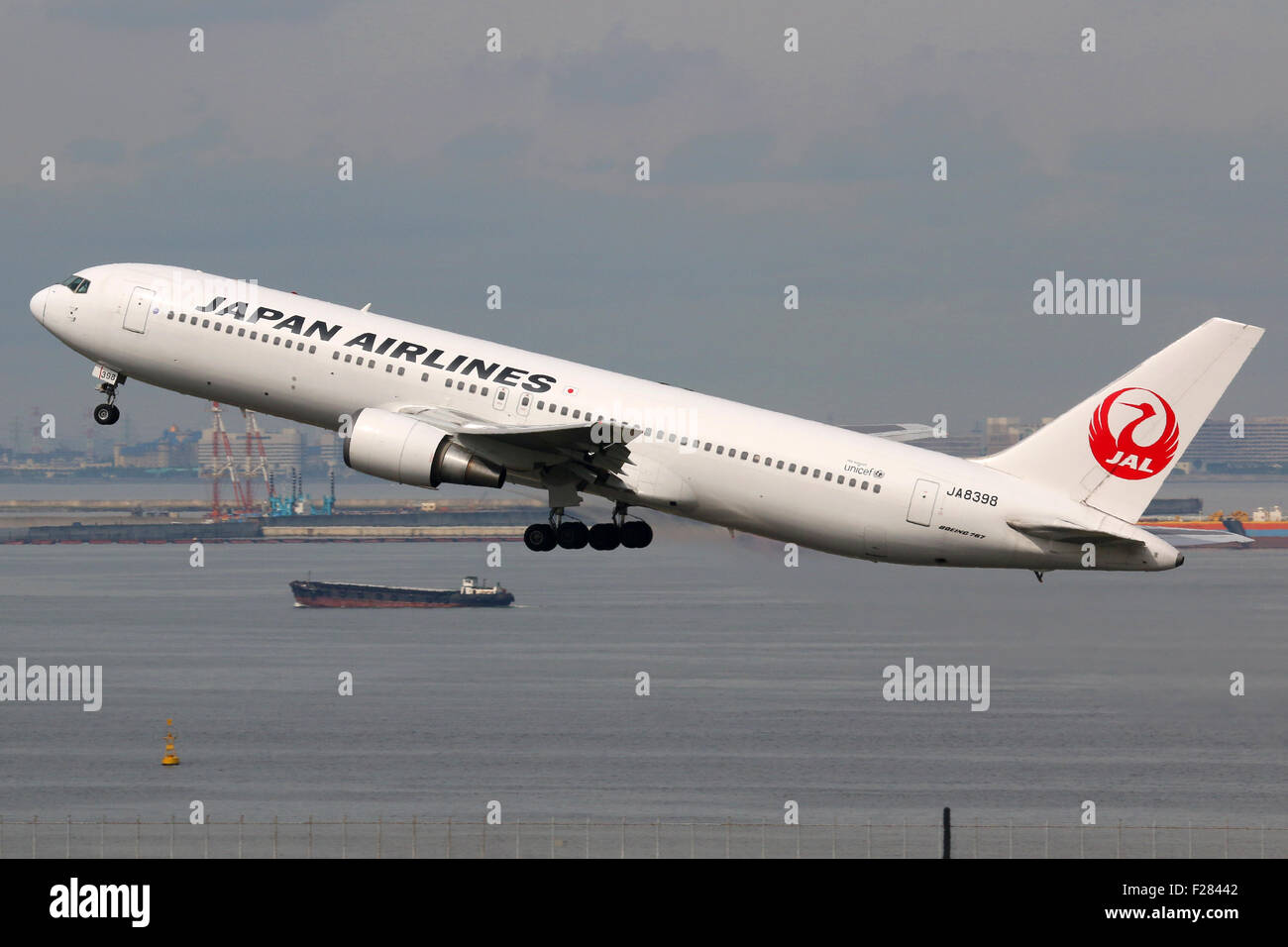 Tokyo, Japan - May 27, 2014: A Japan Airlines Boeing 767-300 with the registration JA8398 taking off at Tokyo Haneda Airport (HN Stock Photo