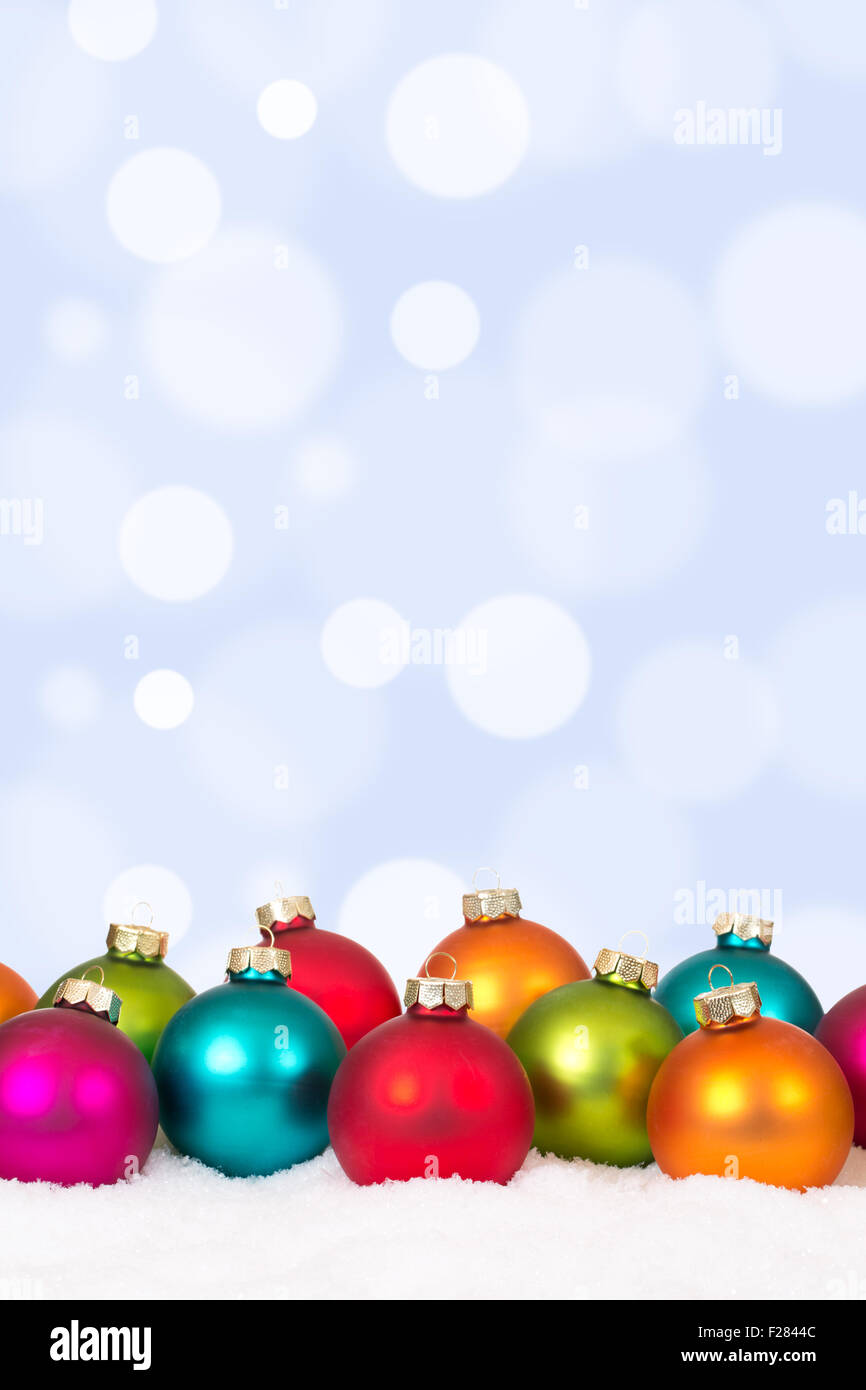 Many colorful Christmas balls background decoration with copyspace and snow Stock Photo