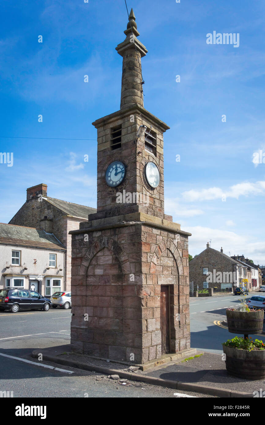 Stone built clock tower in Brough Cumbria England UK Stock Photo