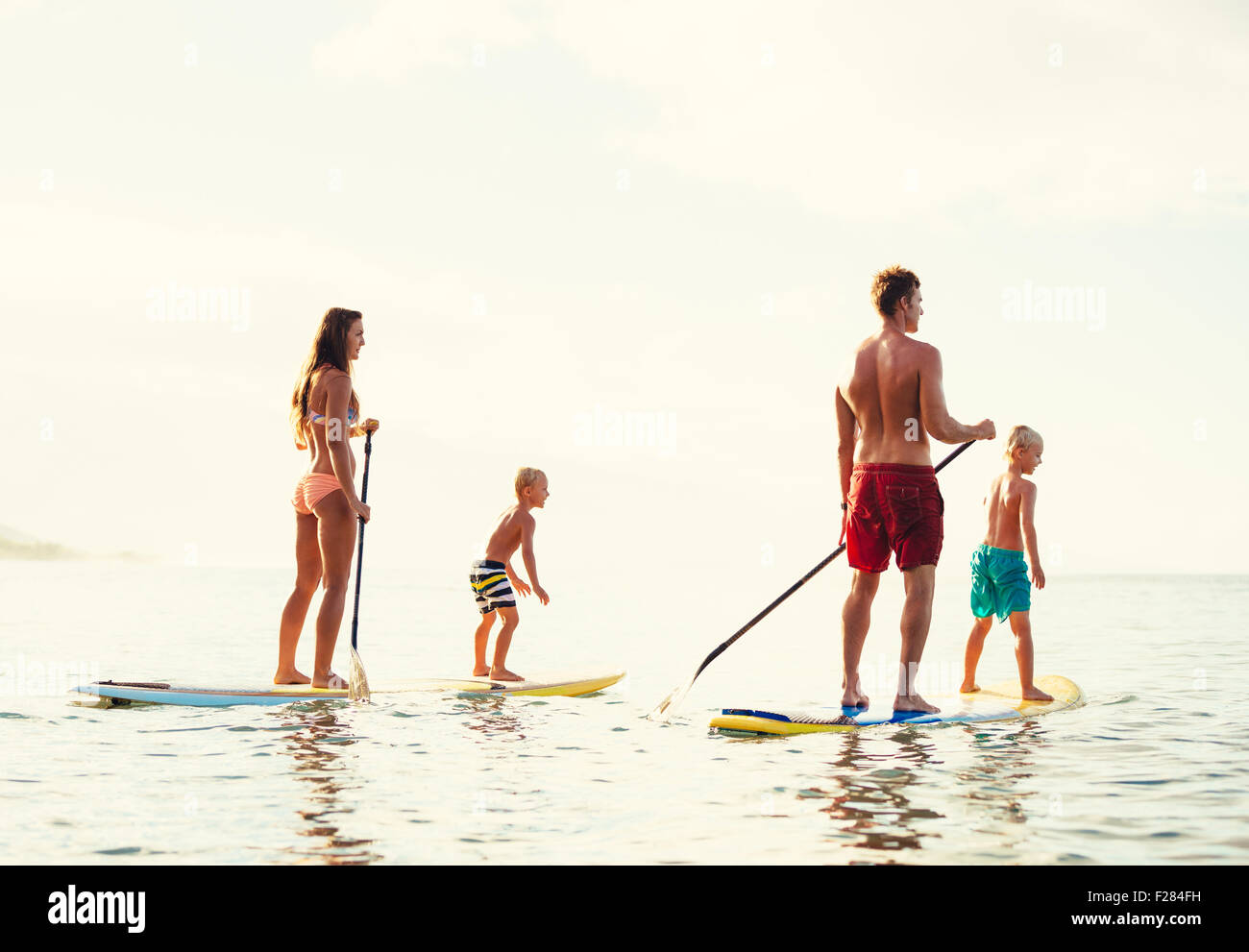 Father son stand up paddling hires stock photography and images Alamy