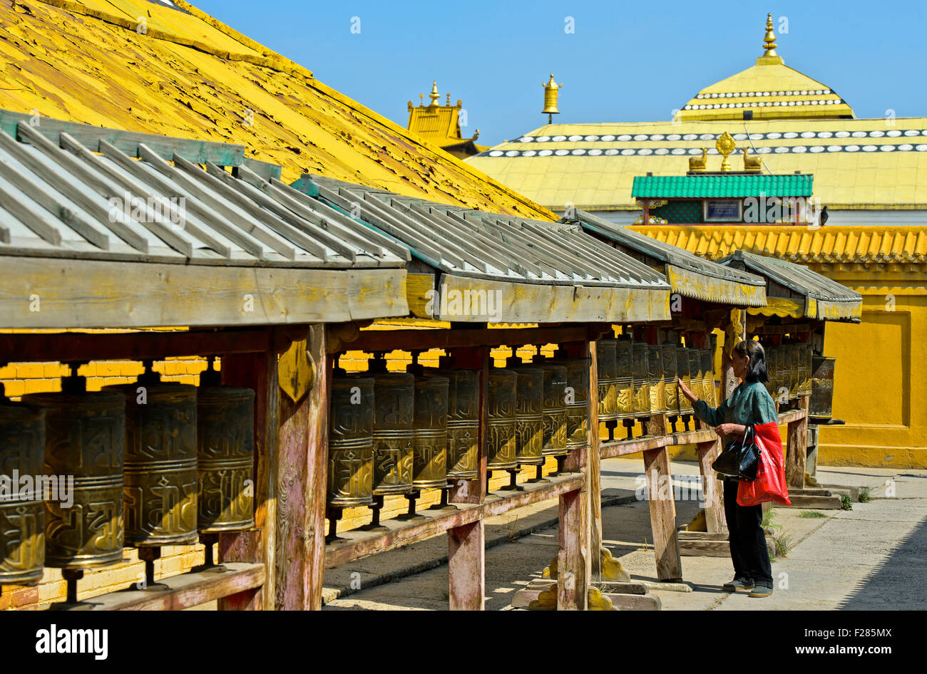Buddhist visitor turningp rayer mills in the Buddhist Gandan Monastery, Ulaanbaatar, Mongolia Stock Photo