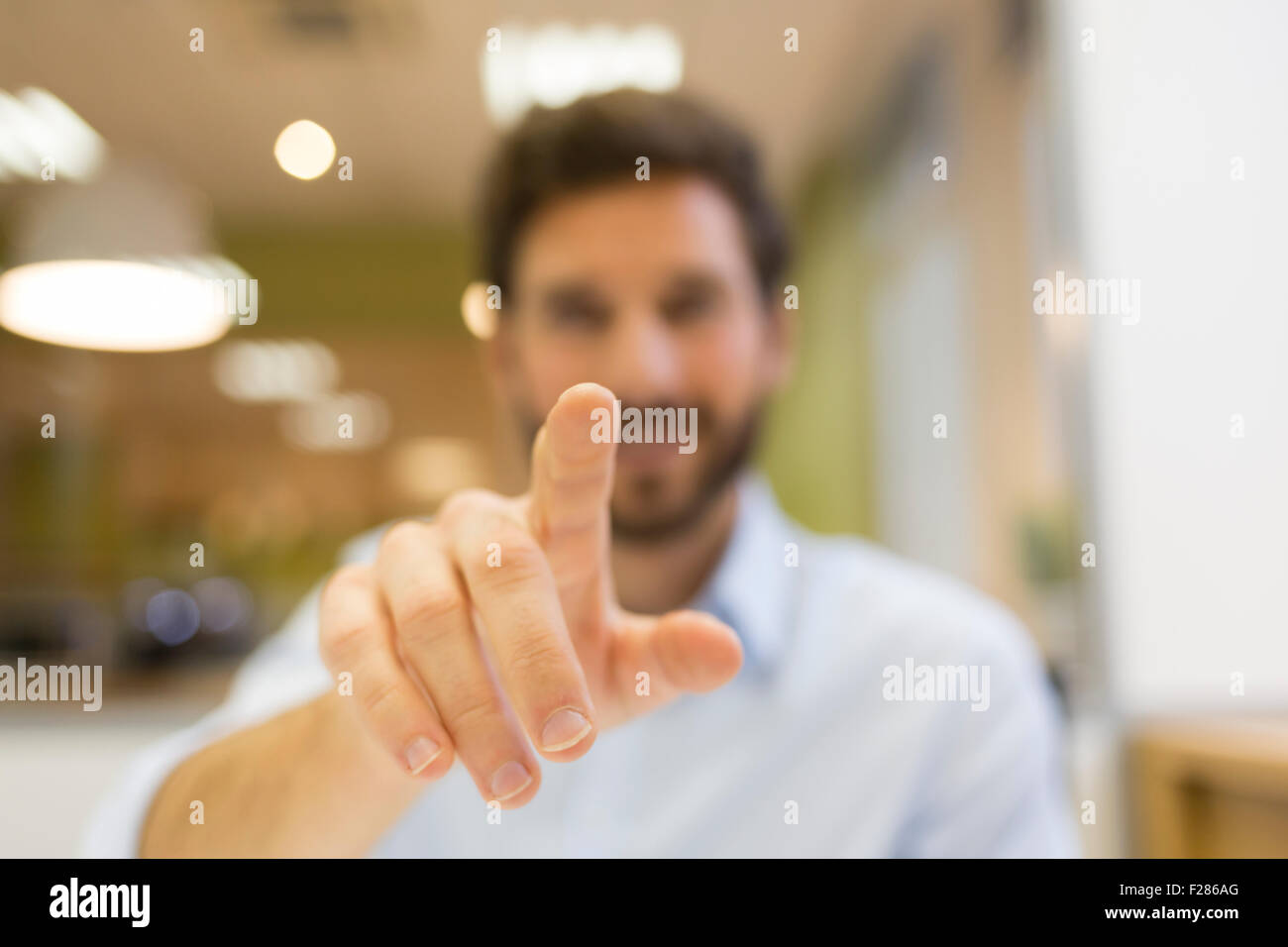 Businessman in office using interactive screen Stock Photo