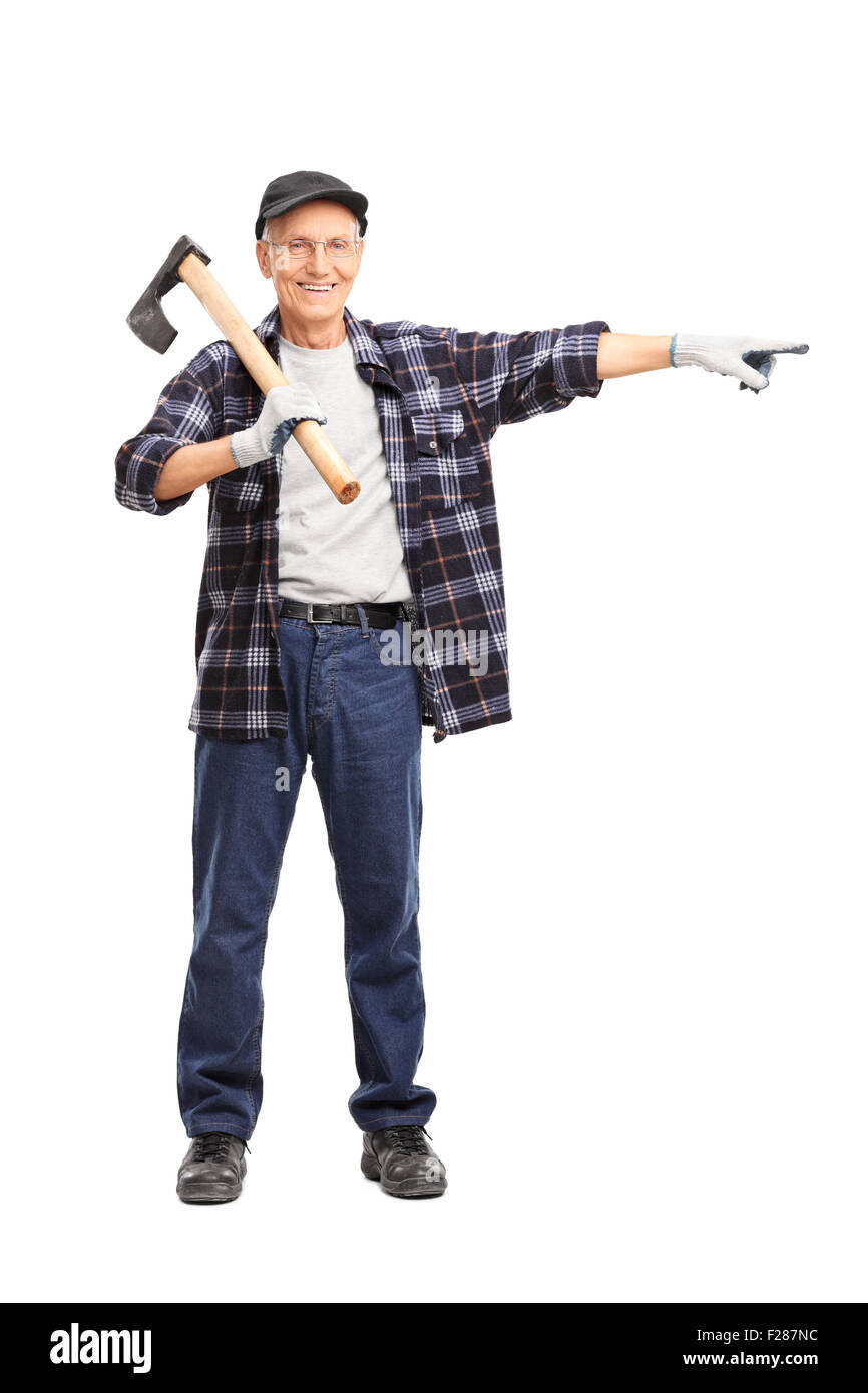 Full length portrait of a senior man holding an ax on his shoulder and pointing isolated on white background Stock Photo