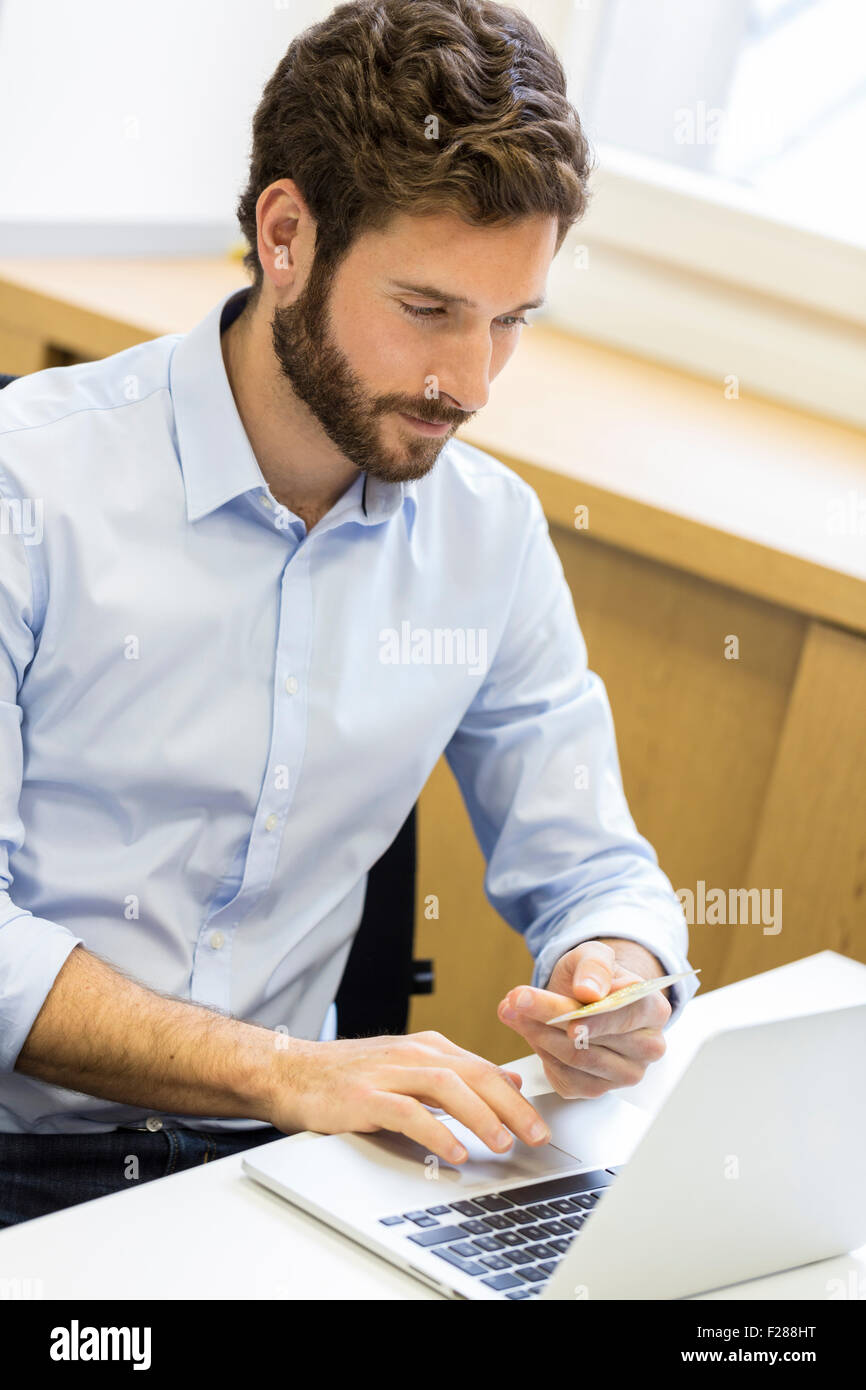 Casual business man paying online with credit card. ecommerce Stock Photo