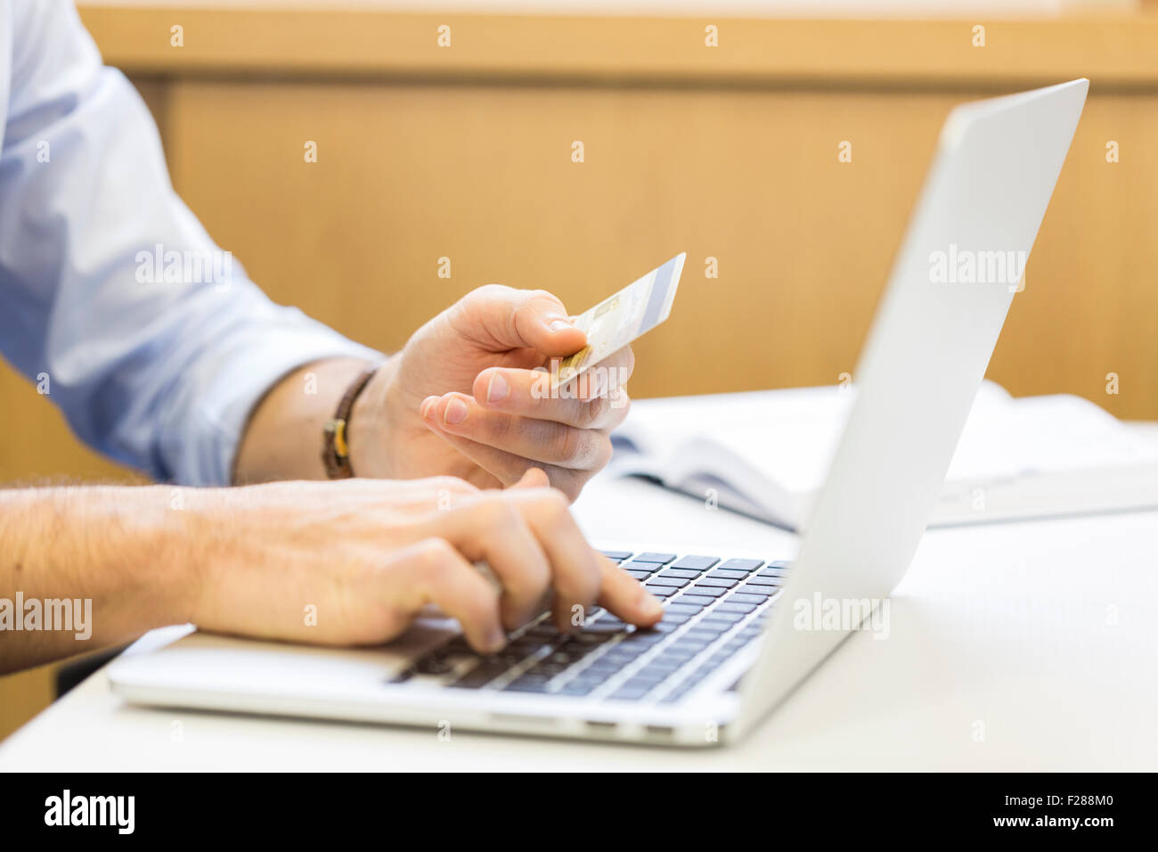 Casual business man paying online with credit card. ecommerce Stock Photo