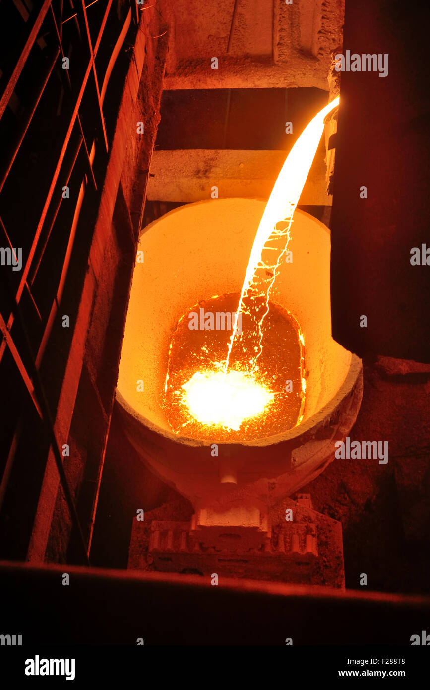 Molten metal poured from ladle Stock Photo