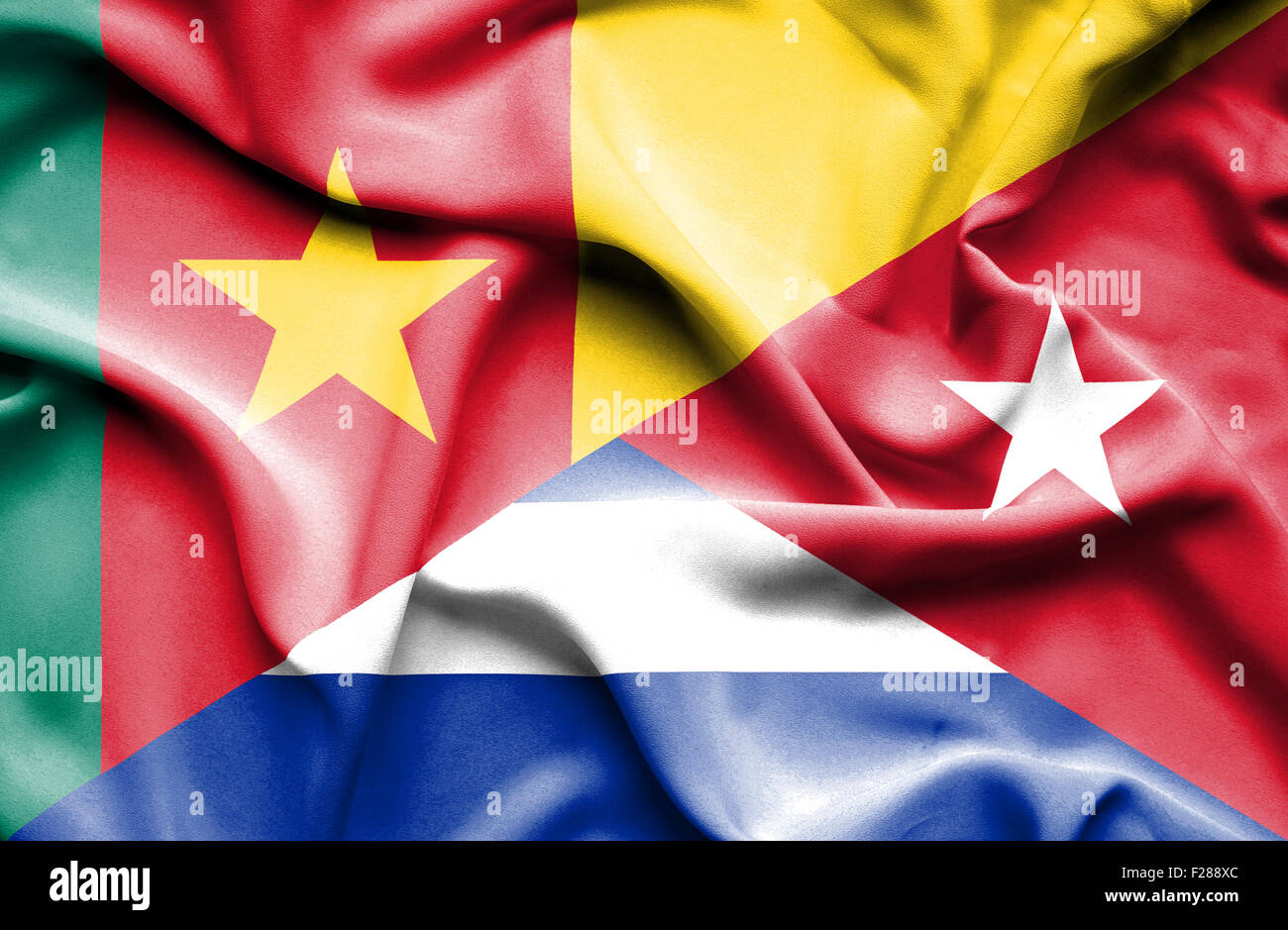 Waving flag of Cuba and Cameroon Stock Photo