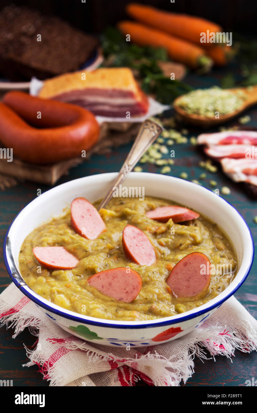Hearty traditional Dutch pea soup with smoked sausage, rye bread and bacon. Or 'erwtensoep met