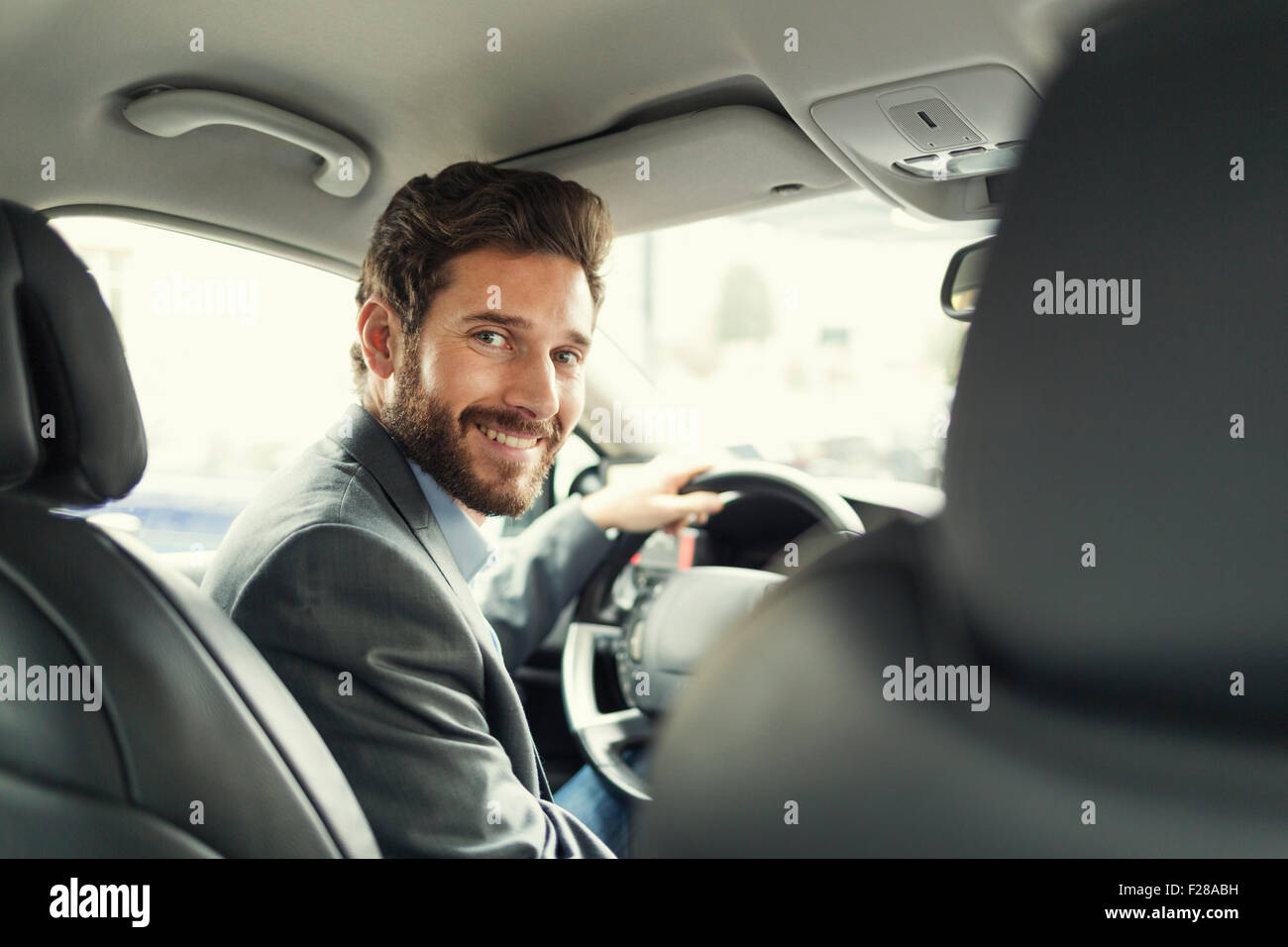 Portrait of man in his car. looking camera Stock Photo