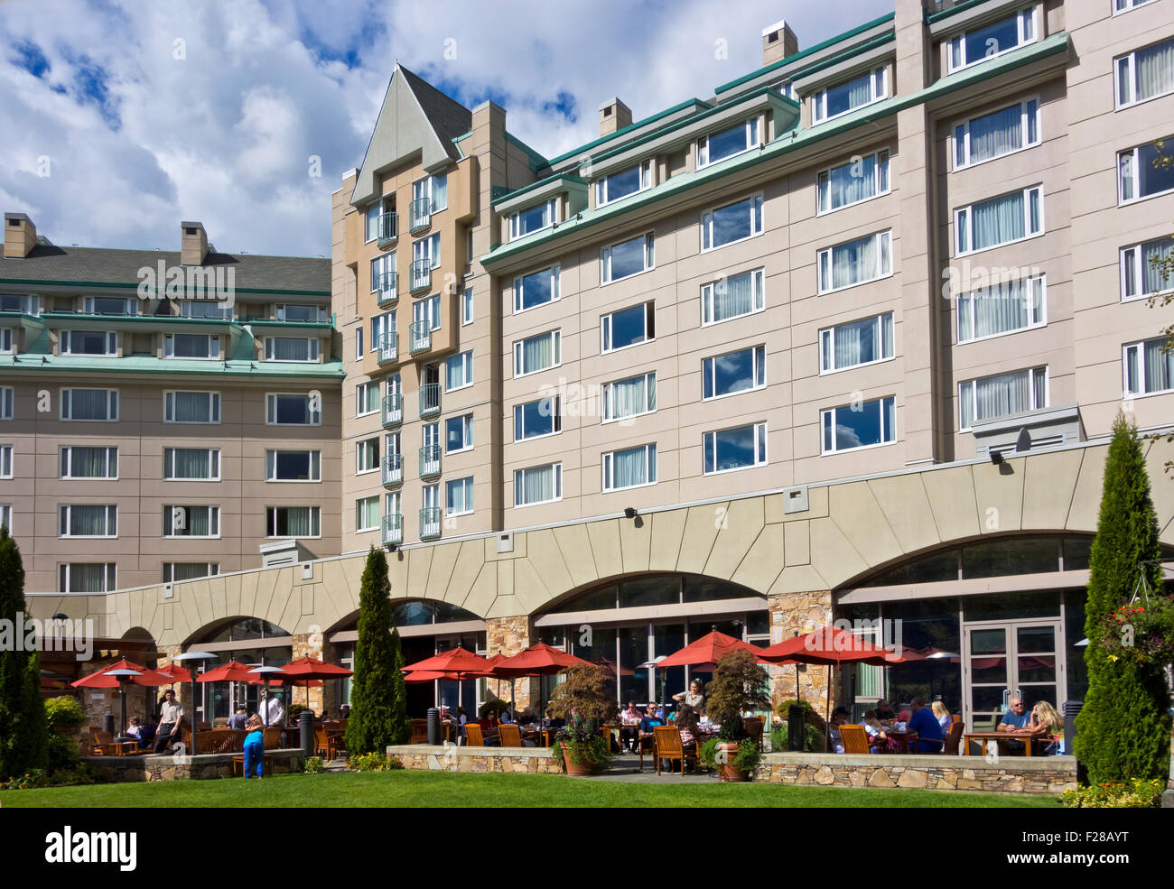 Exterior of the Fairmont Chateau Whistler hotel with outdoor patio in