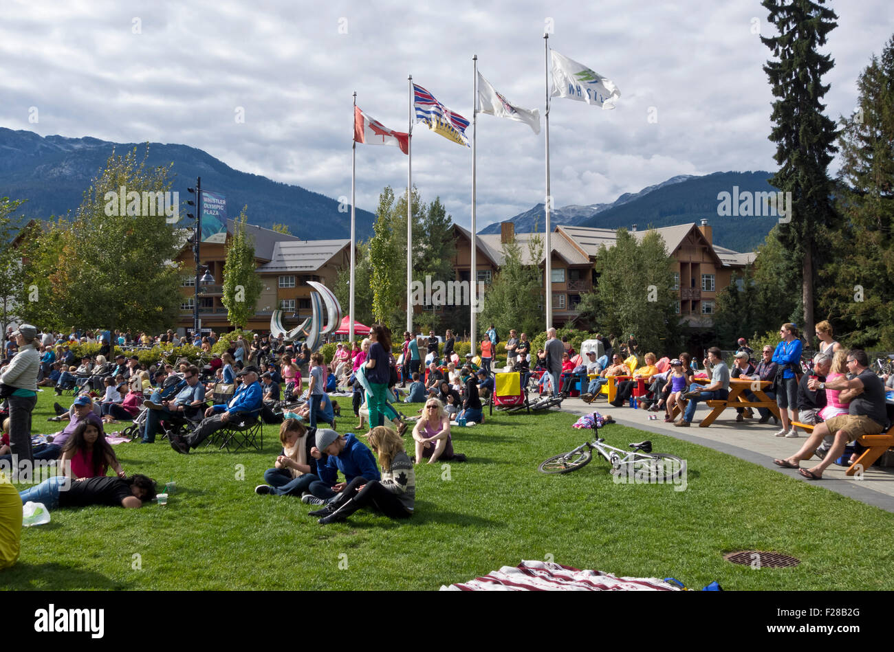 Crowd of people waiting attending an outdoor concert in Whistler Village, British Columbia Canada, on Labour Day weekend 2015. Stock Photo