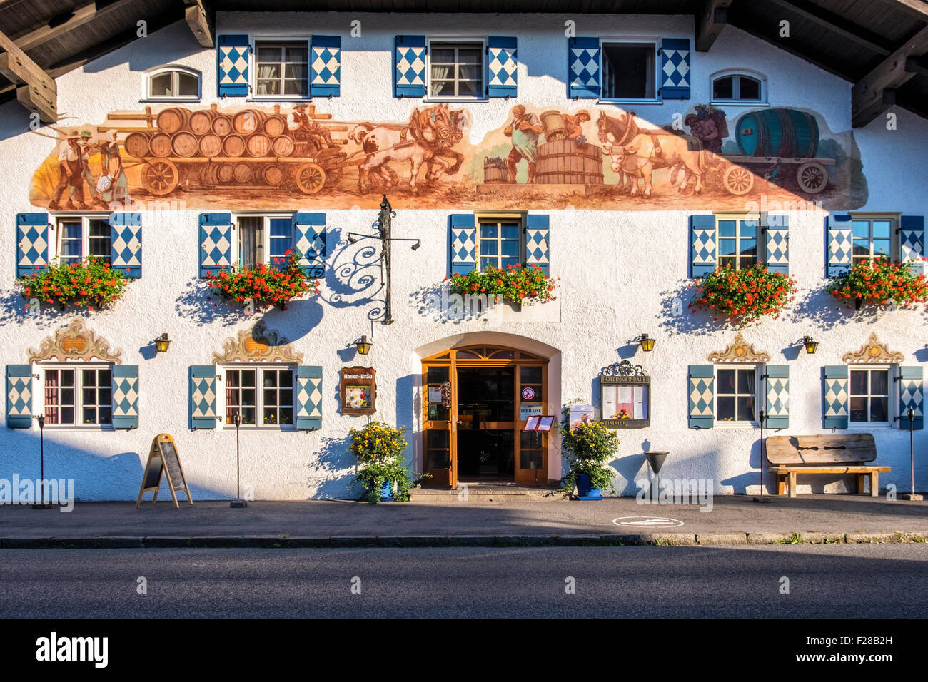 Bavaria, Germany - Hotel Weinbauer, Typical Bavarian architecture, House with wooden shutters and decorative mural painting Stock Photo