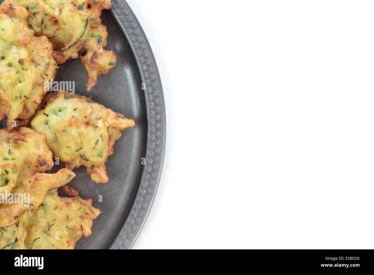 Deep fried courgette cakes, served on a tin plate Stock Photo Alamy