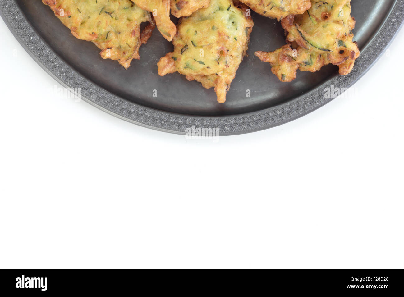 Deep fried courgette cakes, served on a tin plate Stock Photo Alamy