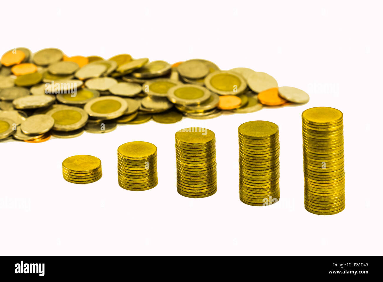 Pile of golden coins graph and pile of coins. Stock Photo