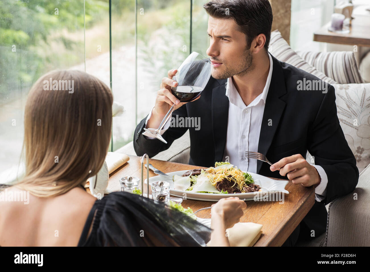 Portirat of a beautiful couple drinking wine in restaurant Stock Photo