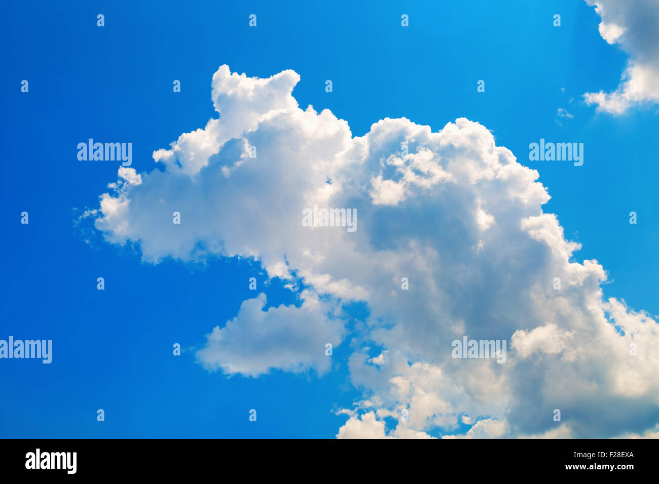 Blue sky with white cumulus cloud. Bright sunny summer day Stock Photo ...