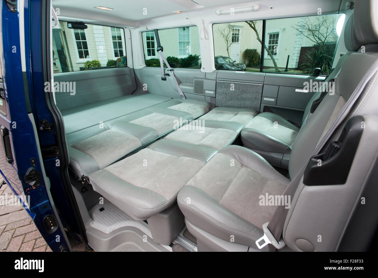 2001 Volkswagen T4 camper van, interior, rear seats folded down into large  bed Stock Photo - Alamy