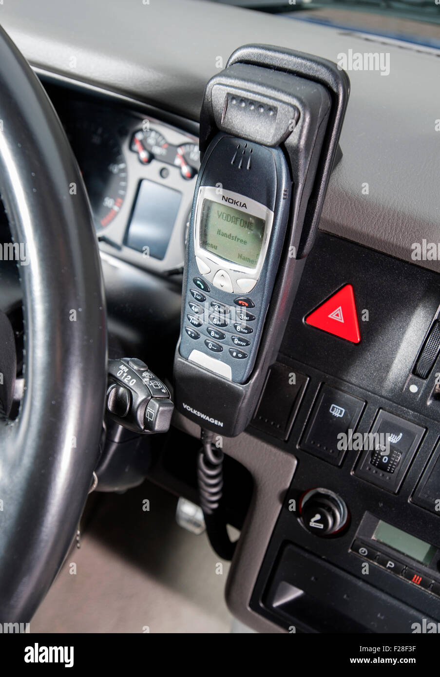 Early Nokia 6310 mobile phone in car handsfree kit fitted to a 2001 Volkswagen T4 camper van Stock Photo
