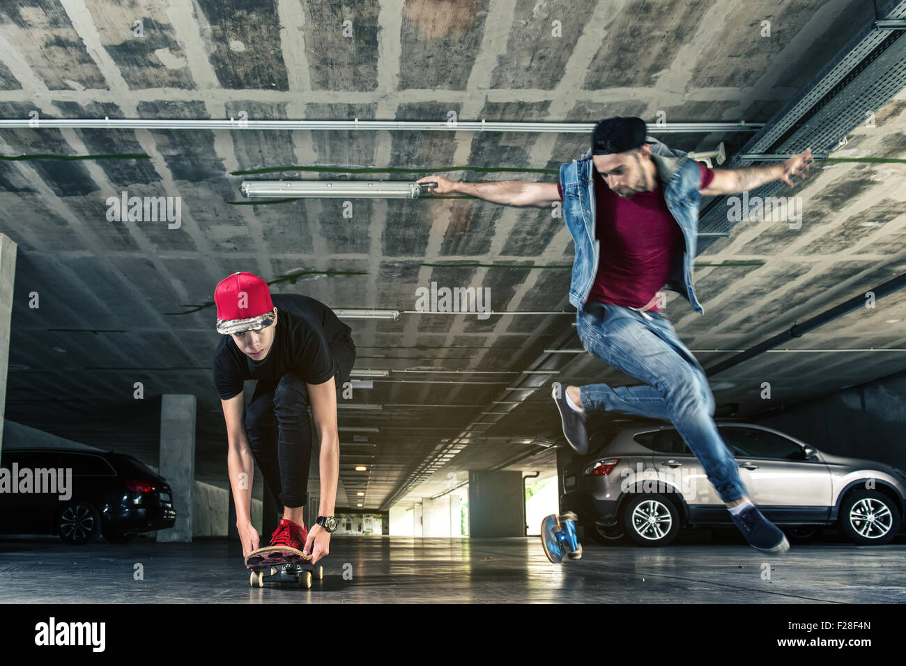 Professional skateboarder jumps in the subway Stock Photo