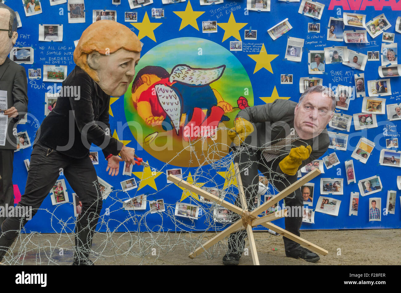 Brussels, Belgium. 14th Sep, 2015. Actors dress and wear face masks
