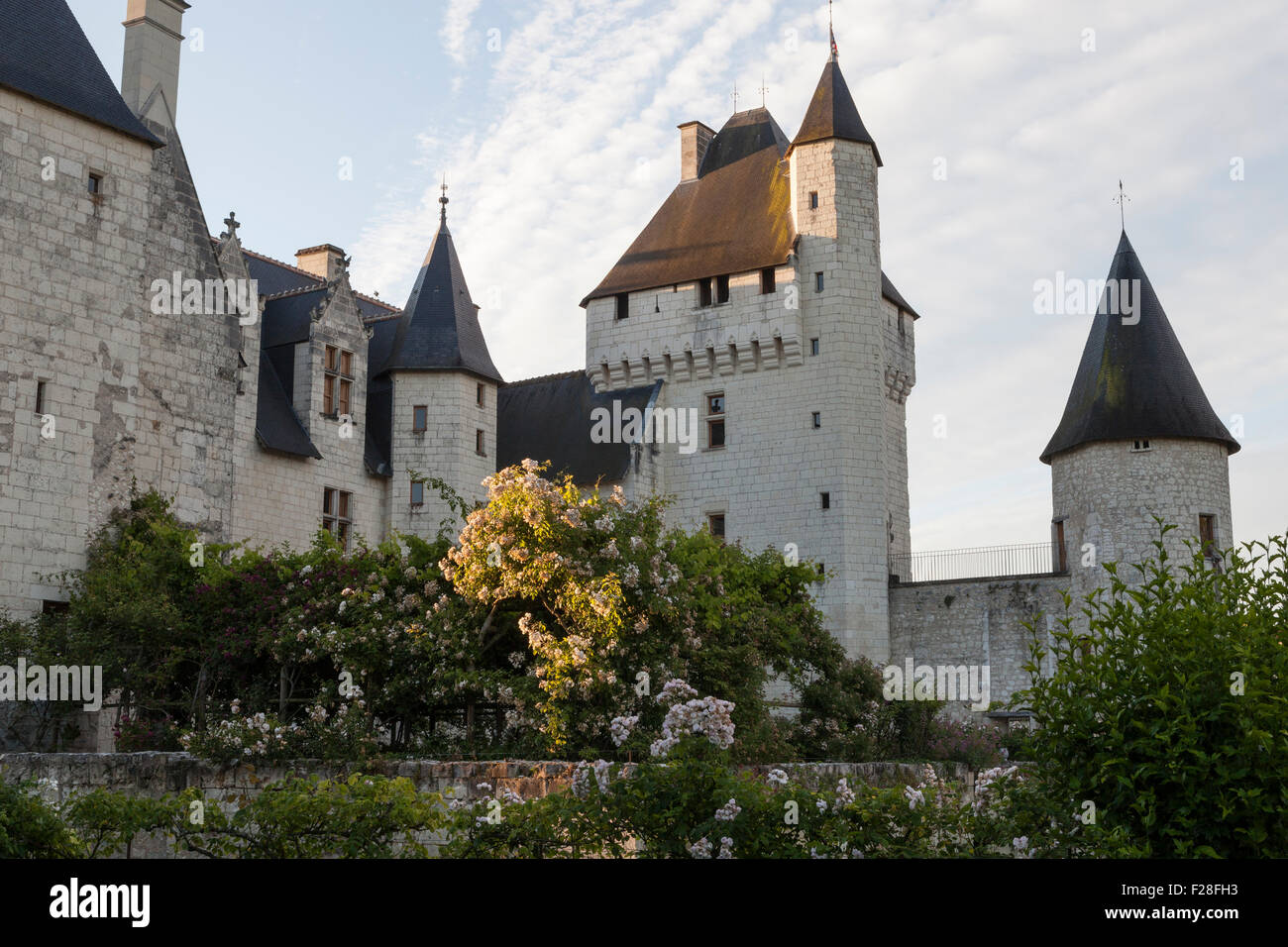 Chateau du Rivau, early morning light with rose beds in foreground Stock Photo