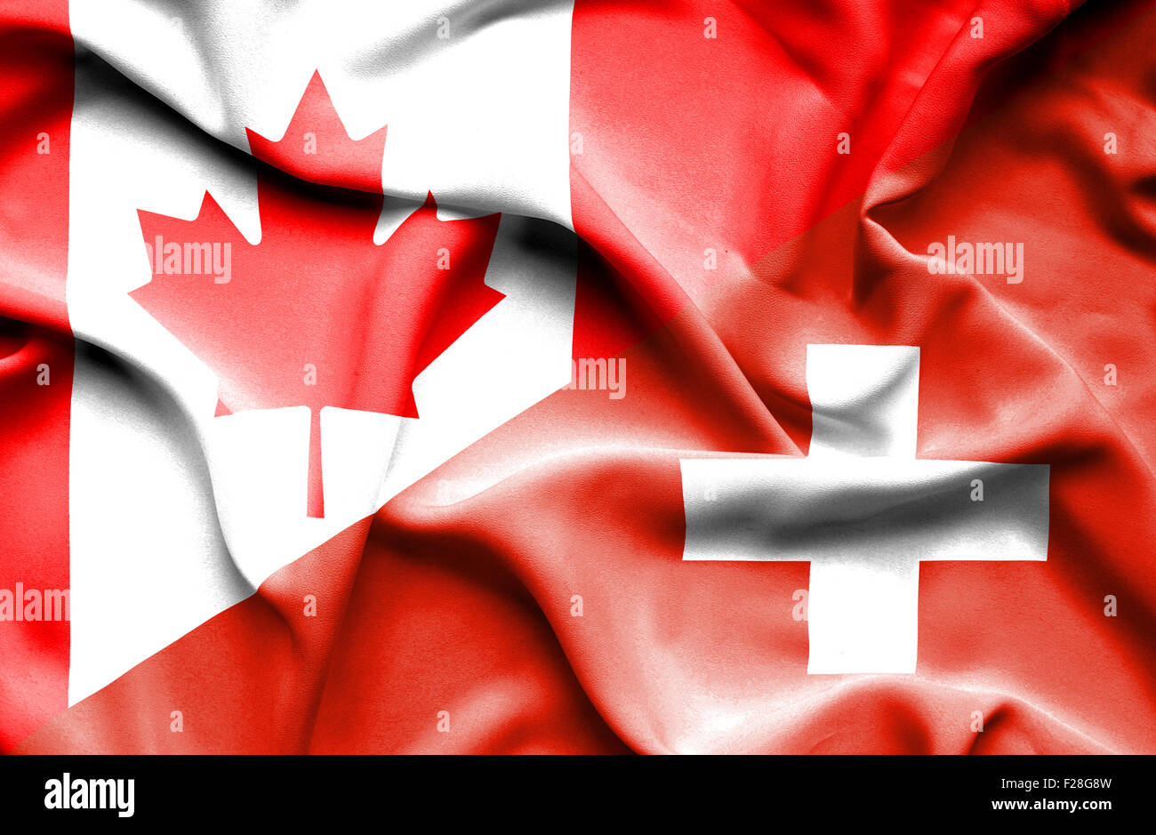 Waving flag of Switzerland and Canada Stock Photo - Alamy