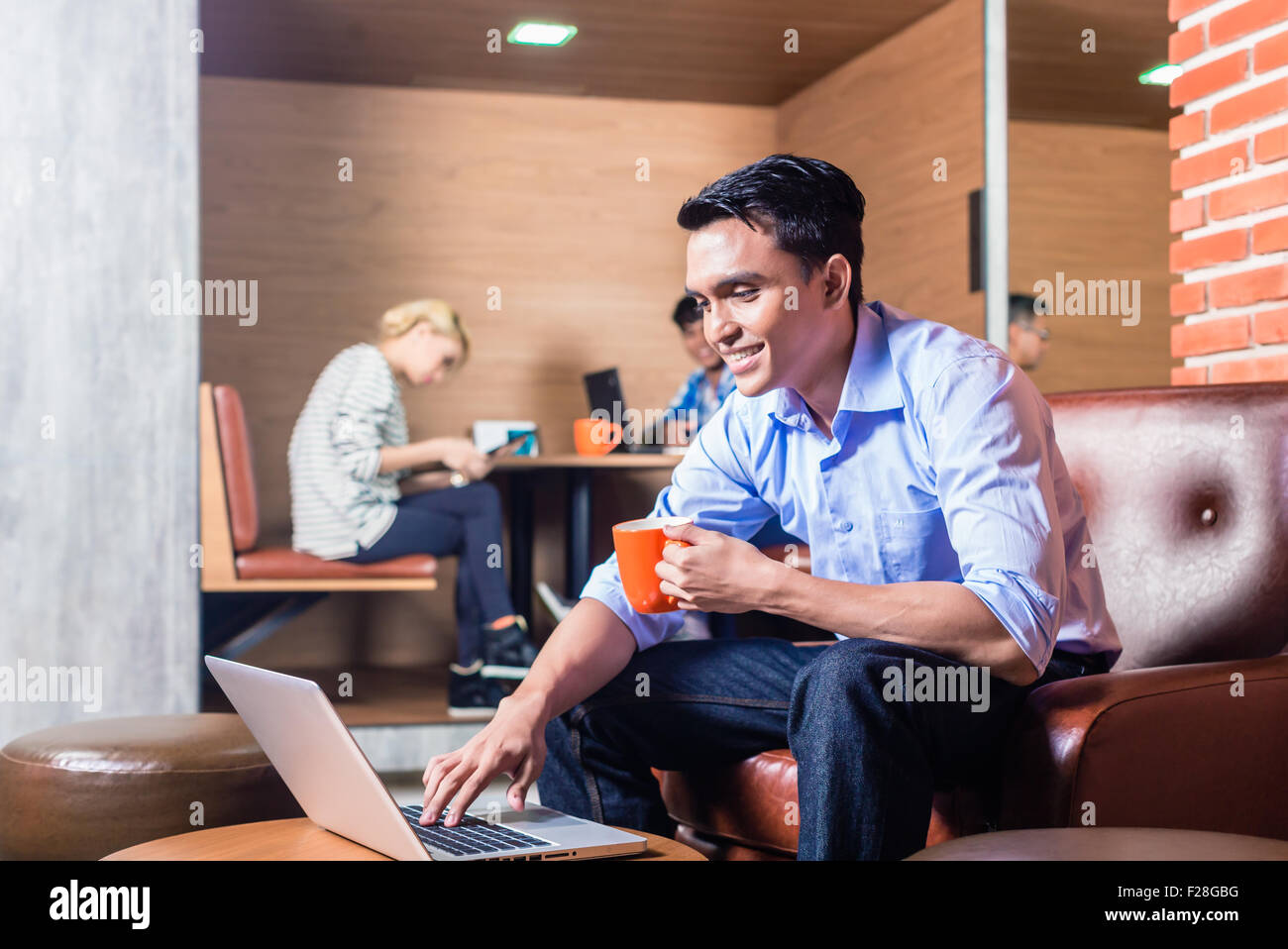 Creative business people in coworking office Stock Photo