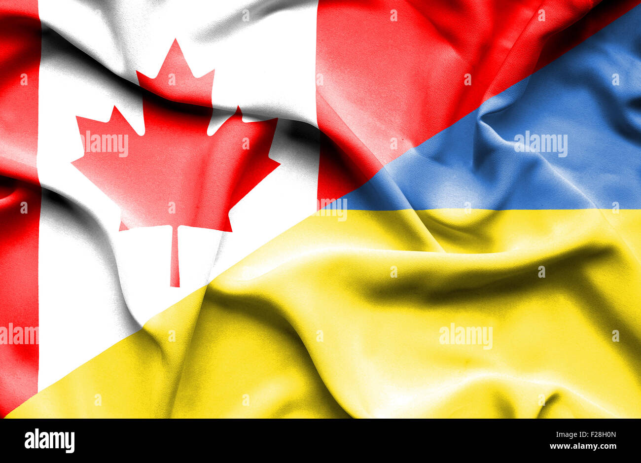 Waving flag of Ukraine and Canada Stock Photo - Alamy