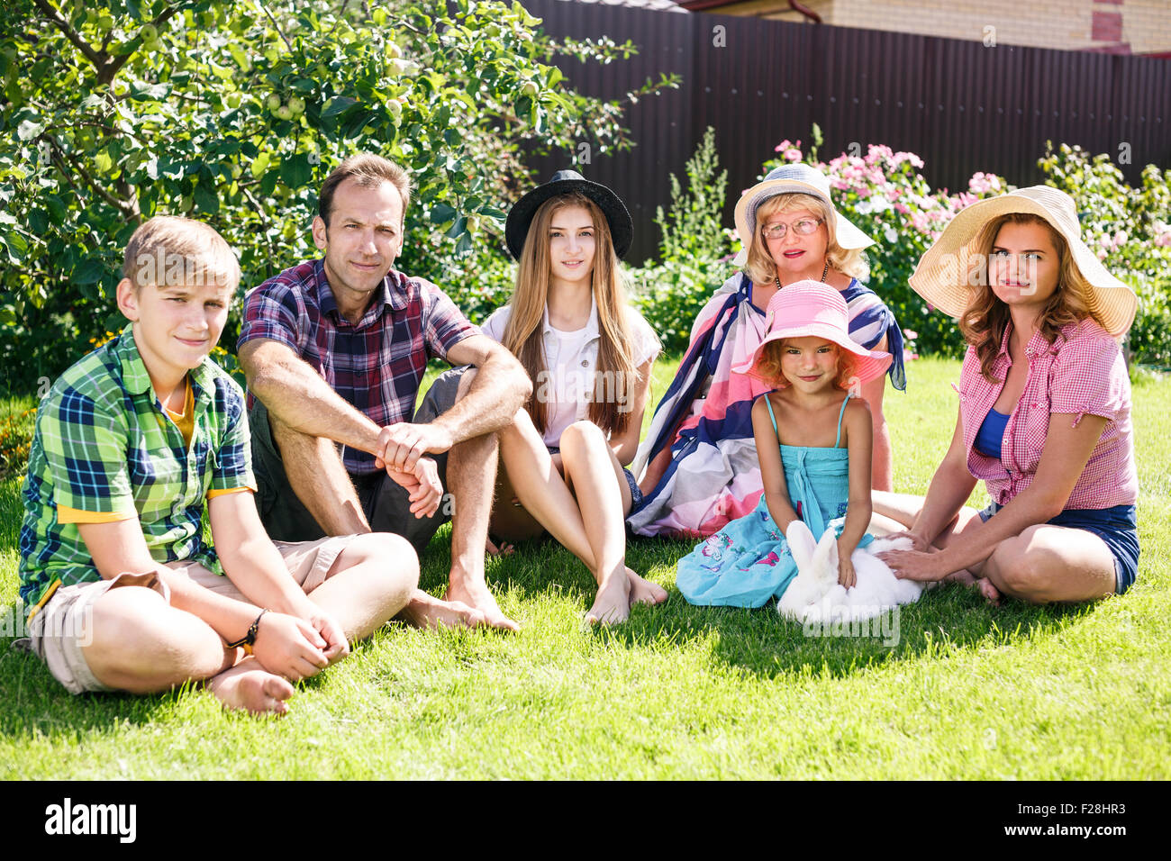 Big family relaxing in the summer park Stock Photo