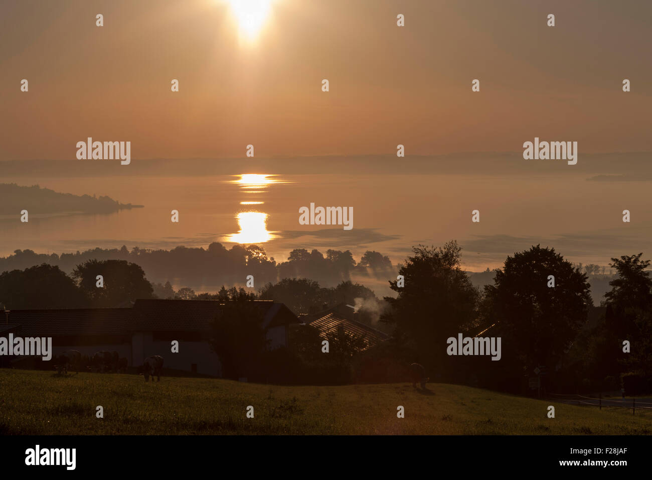 Sun shining over Chiemsee lake, Bavaria, Germany Stock Photo