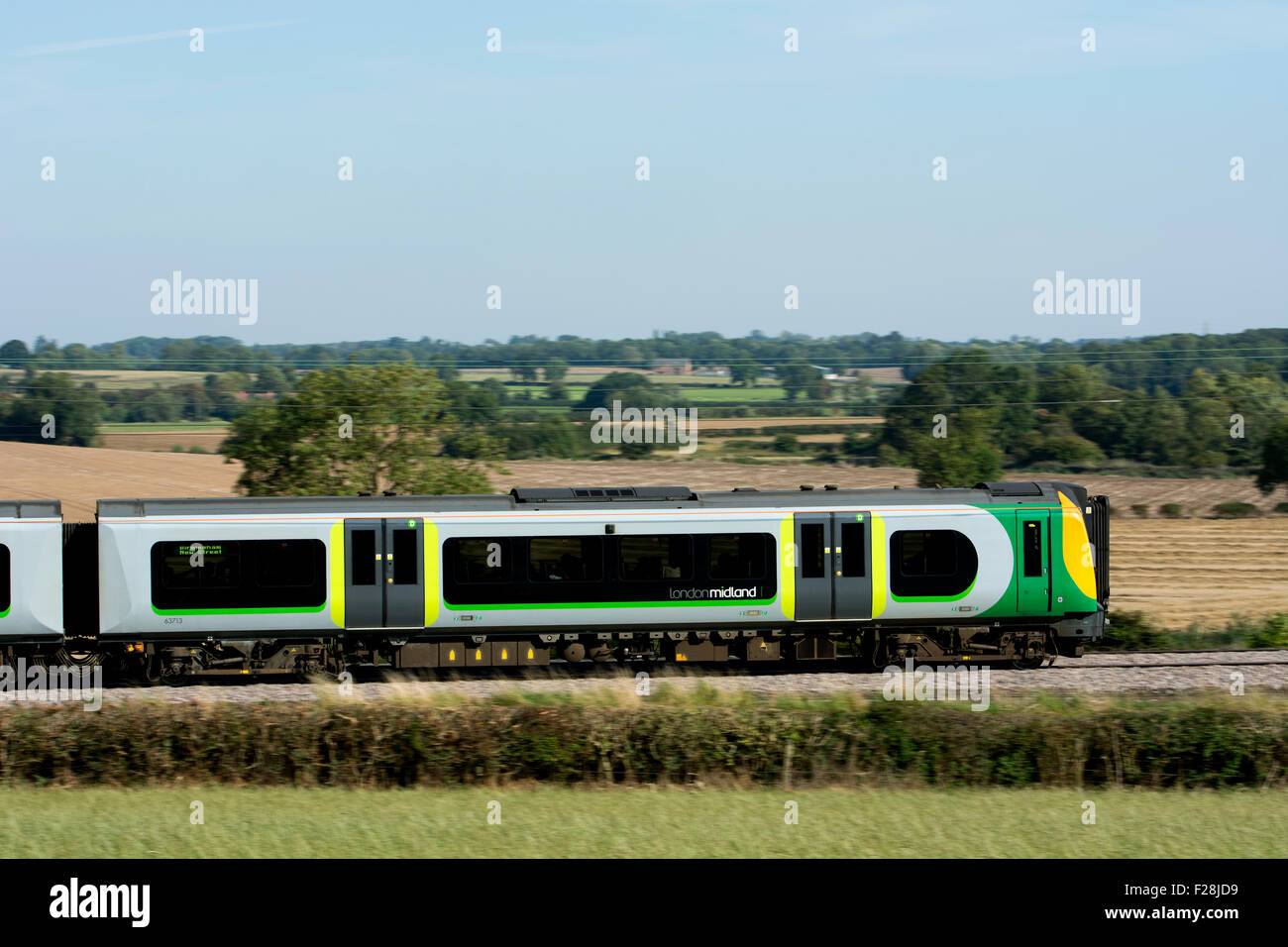 London Midland electric train at speed, Warwickshire, UK Stock Photo