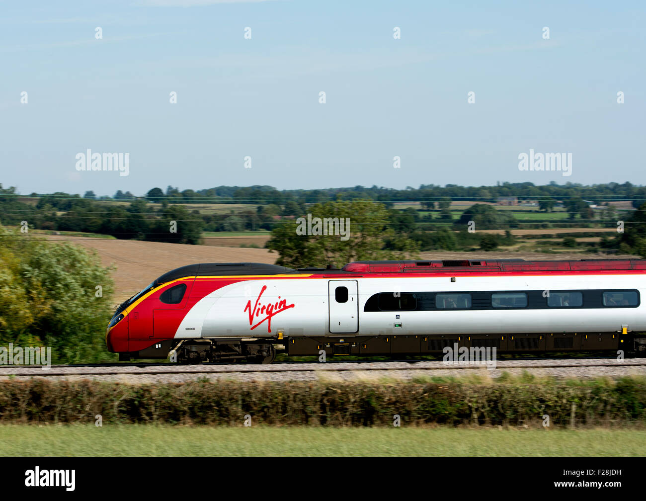 Virgin Trains Pendolino at speed, Warwickshire, UK Stock Photo
