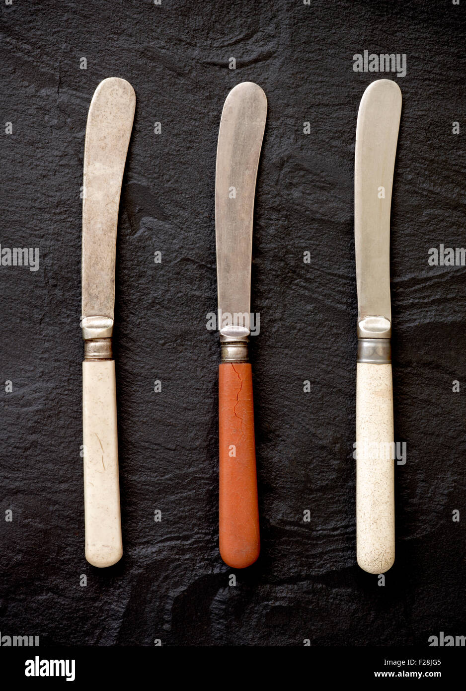 Three Old or Vintage Butter Knives Stock Photo