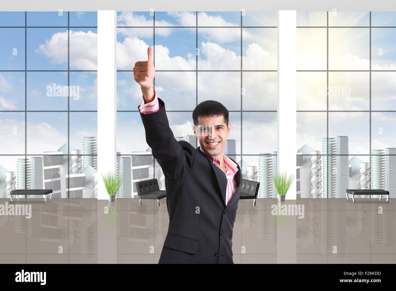 Happy businessman shows thumbs up sign Stock Photo