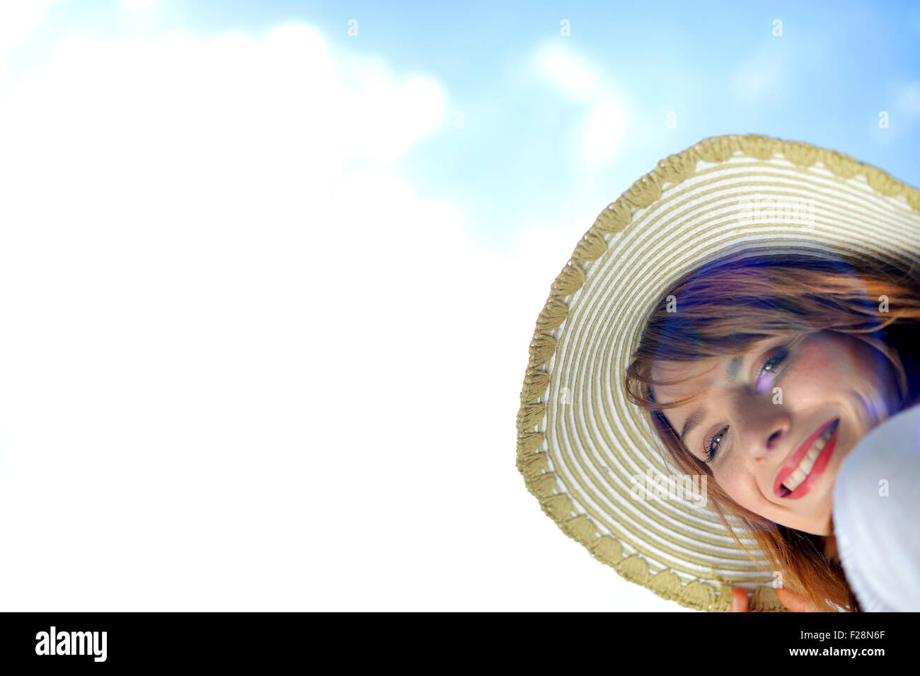 Portrait of a woman wearing a sun hat Stock Photo - Alamy