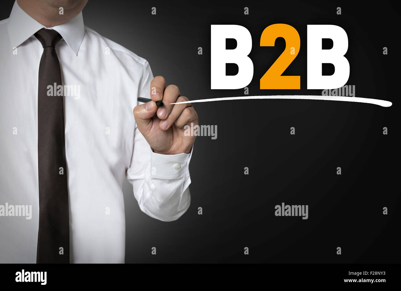 B2B is written by businessman background concept. Stock Photo