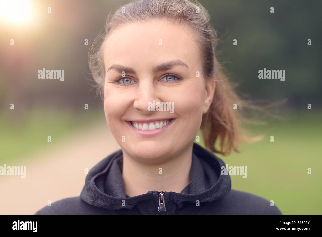Close up Head and Shoulder Shot of a Fit Young Woman Looking at the ...