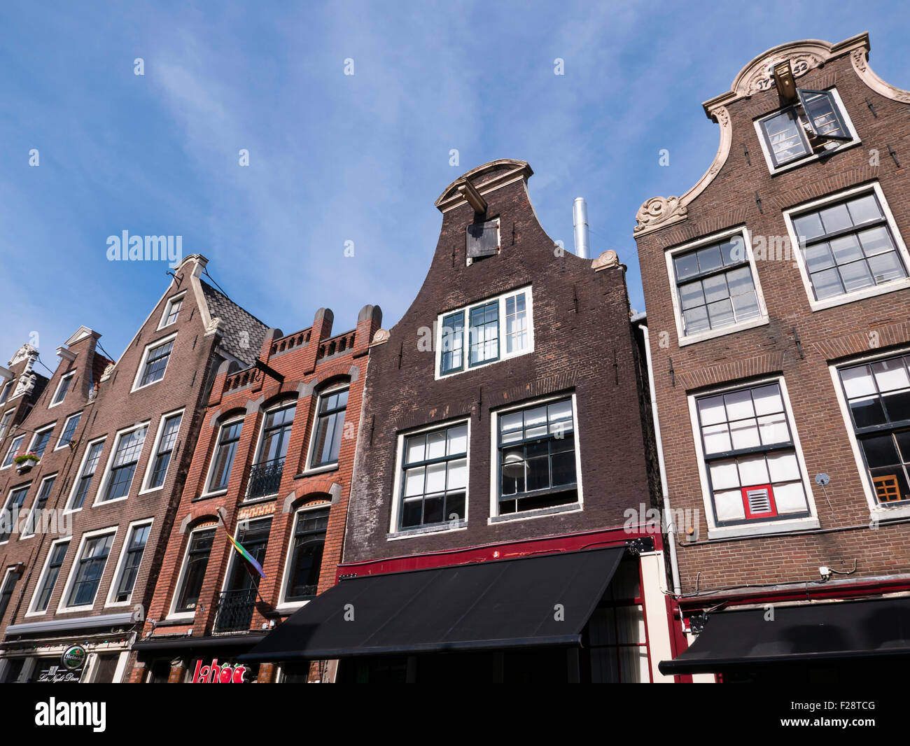 Traditional gabled architectural building fronts in Amsterdam. North Holland, Kingdom of Netherlands. Stock Photo