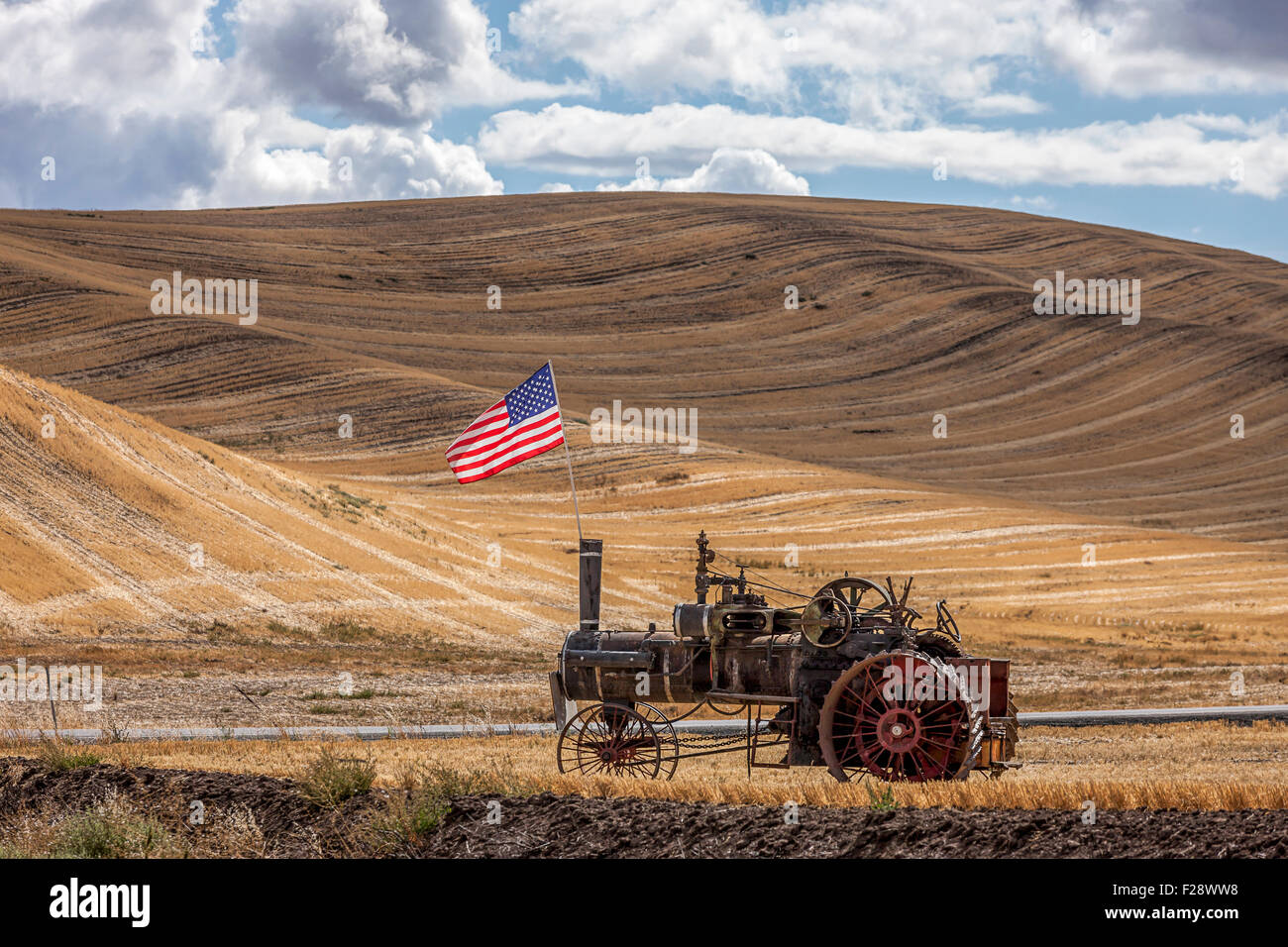 Steam engine and flag in field Stock Photo - Alamy