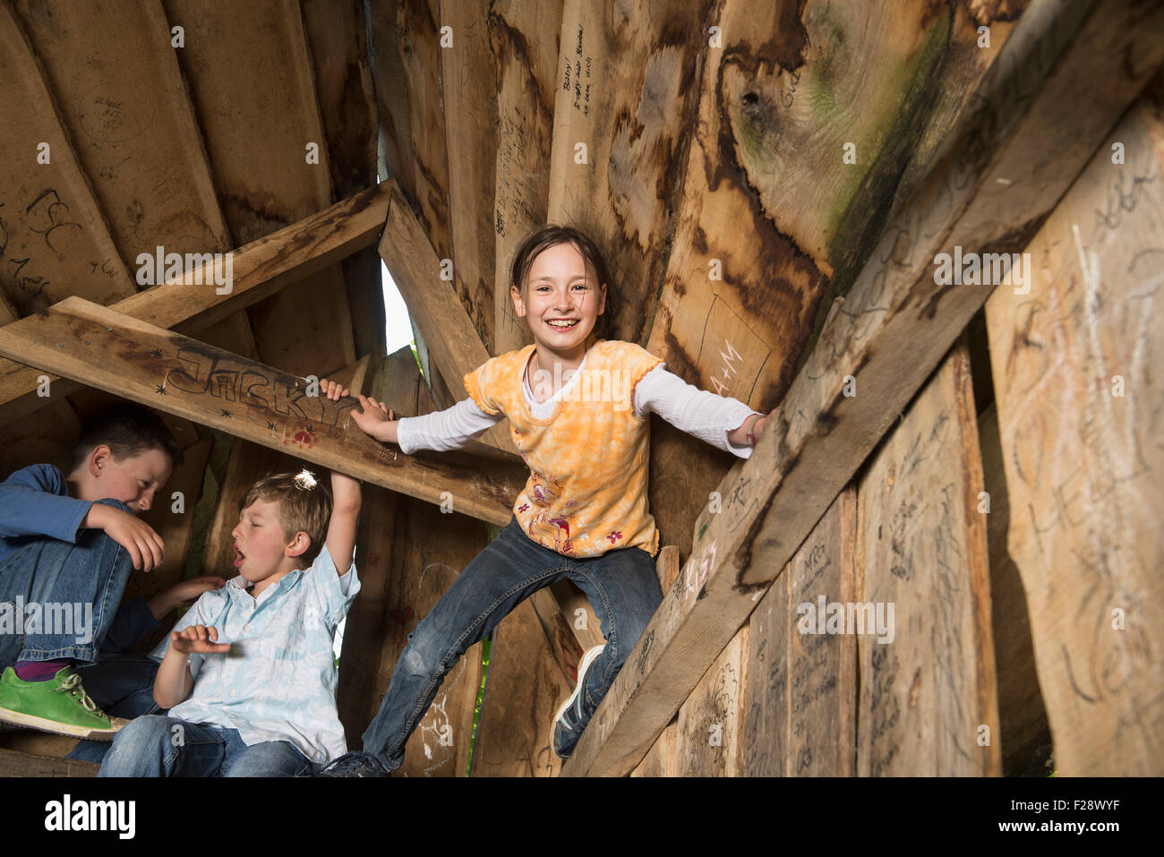 Three children playing in a playground, Munich, Bavaria, Germany Stock