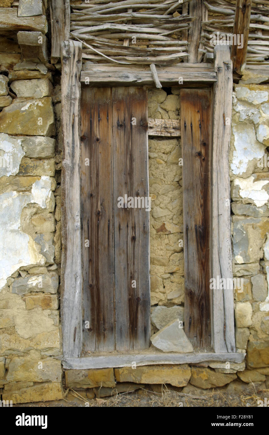 Walled door of an abandoned dilapidated old house. Stock Photo