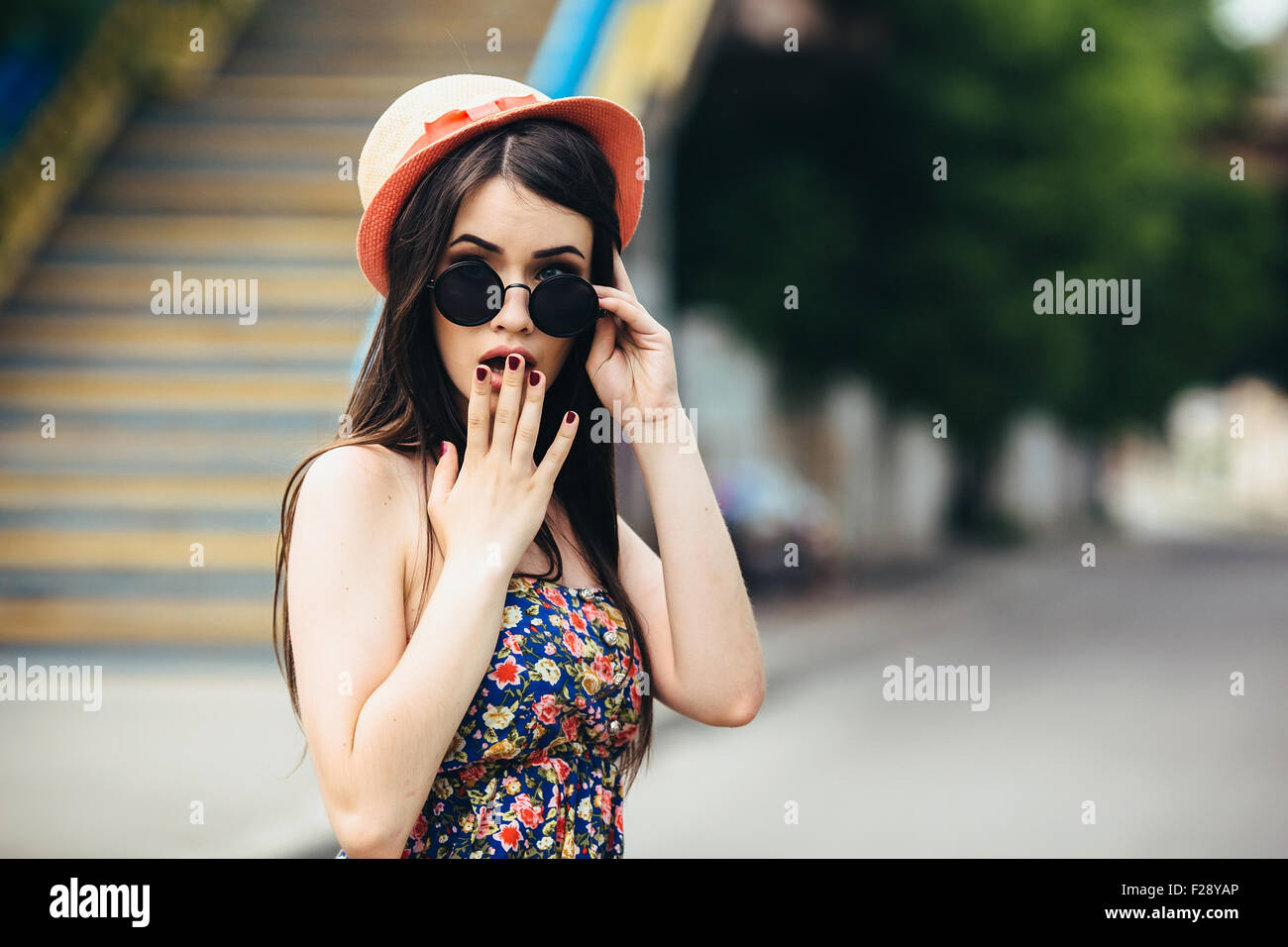 beautiful girl poses for camera in the city Stock Photo