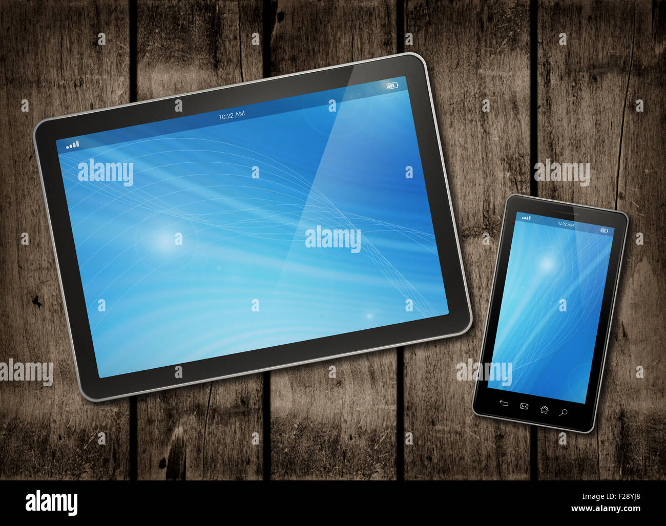 Smartphone and digital tablet PC on a dark wood table - horizontal office mockup Stock Photo